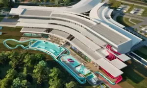 Nowoczesny aquapark Rzeszów z basenami, zjeżdżalniami i strefą relaksu, otoczony zielenią.